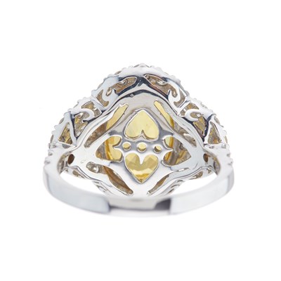 Lot 56 - An 18ct gold yellow sapphire and diamond...