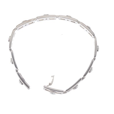 Lot 57 - An 18ct gold square-shape diamond line...