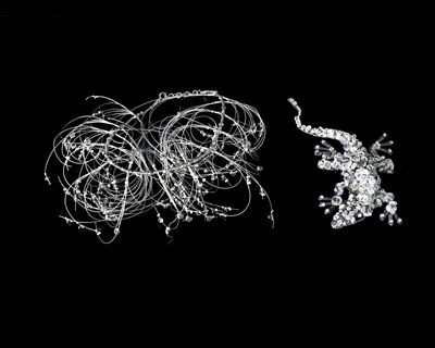 Lot 57 - A silver wire and faceted paste multi-strand necklace, together with a paste lizard brooch