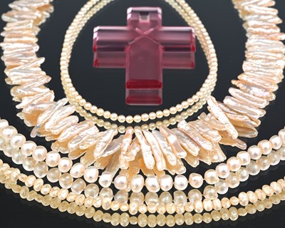 Lot 8 - A cultured pearl necklace, a glass cross by Baccarat, pearls and a pair of 9ct gold garnet earrings