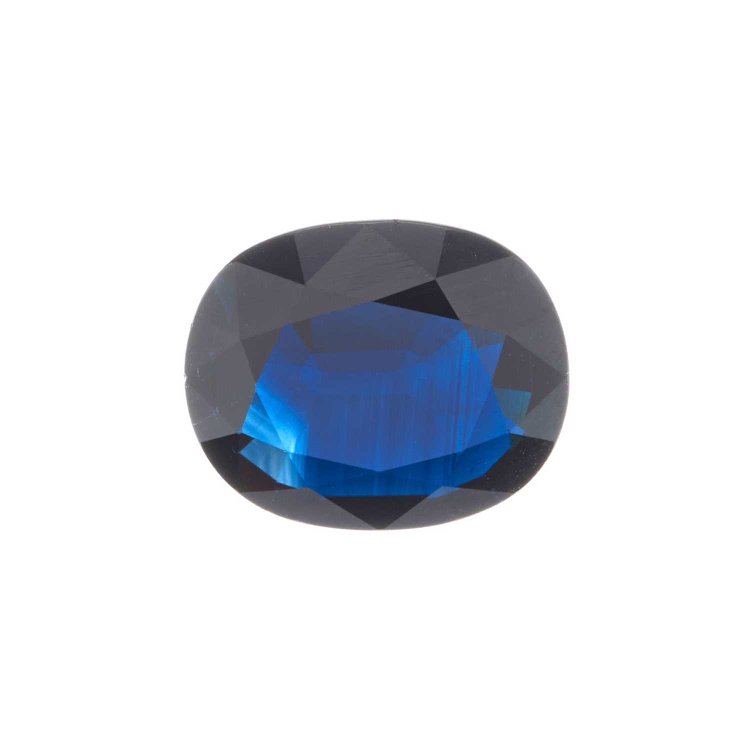 Lot 77 - A cushion-shape natural sapphire, weighing...