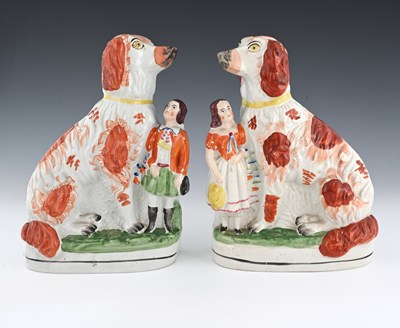 Lot 674 - A pair of Staffordshire flat back figure...