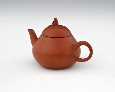 Lot 371 - A small Chinese red clay teapot with bird...