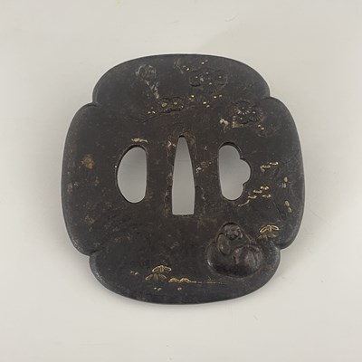 Lot 343 - A Japanese iron tsuba with Buddha and blossom...