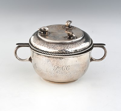 Lot 117 - A.E. Jones, an Arts and Crafts silver...