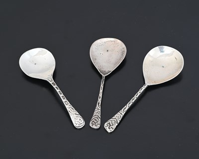 Lot 124 - Three Iona Arts and Crafts silver caddy spoons,...