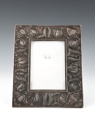 Lot 105 - An Arts and Crafts white metal photograph...