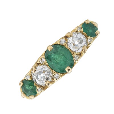 Lot 117 - A 1970s 18ct gold vari-shape emerald and...