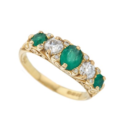 Lot 117 - A 1970s 18ct gold vari-shape emerald and...