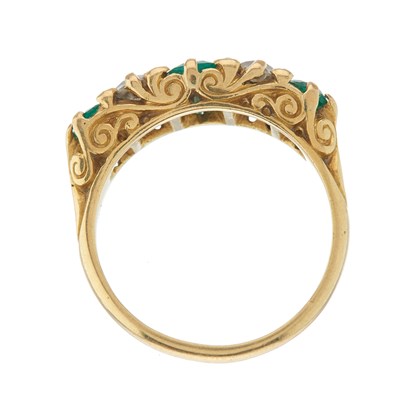 Lot 117 - A 1970s 18ct gold vari-shape emerald and...