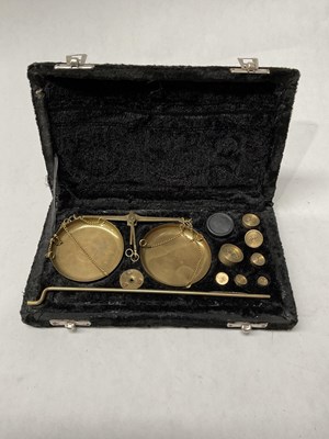 Lot 208 - A cased set of brass apothecary or jeweller's...