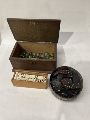 Lot 210 - A cased set of bone and ebony dominos,...