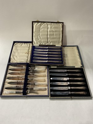 Lot 184 - Silver flatware: a set of fish knives and...