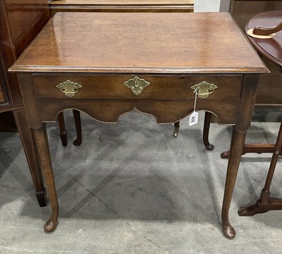 Lot 408 - A small proportioned George III oak low boy,...