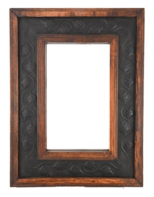 Lot 171 - An Arts and Crafts copper and wood wall mirror,...