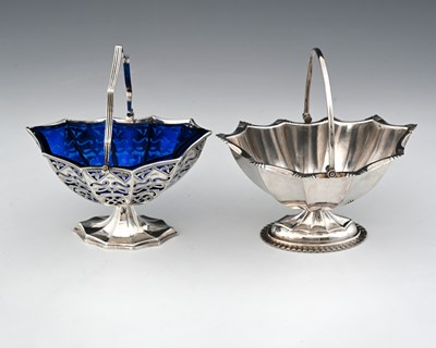 Lot 101 - An Elizabeth II silver navette swing handle...