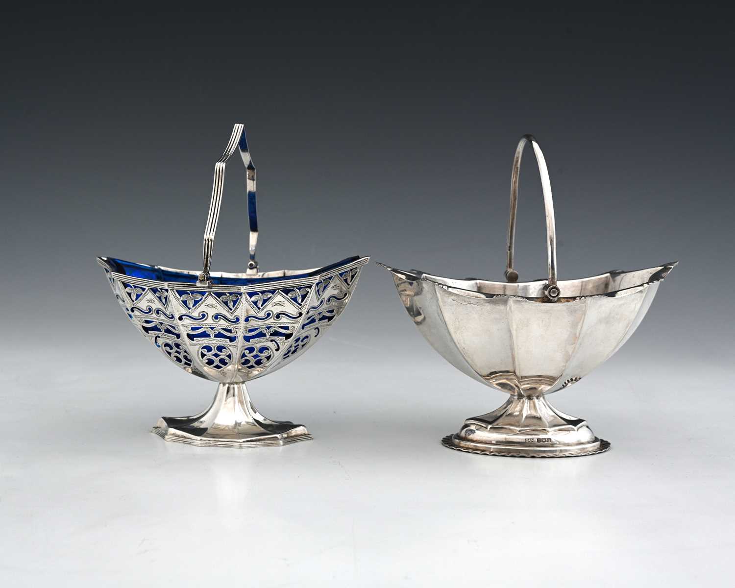 Lot 101 - An Elizabeth II silver navette swing handle...
