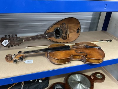 Lot 196 - A mandolin and a violin with bow for...