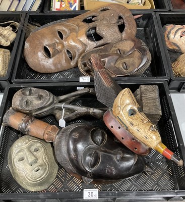 Lot 30 - A collection of tribal type wooden masks, most...