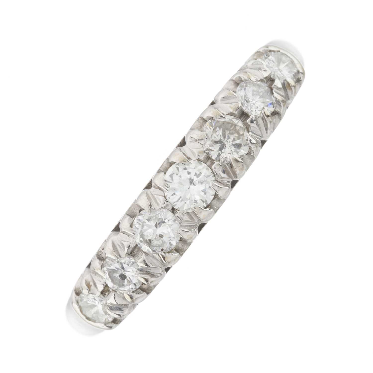 Lot 48 - An 18ct gold diamond half eternity ring