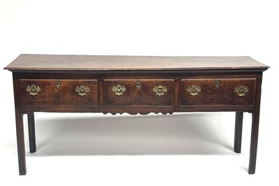 Lot 228 - A George III country oak standing dresser,...