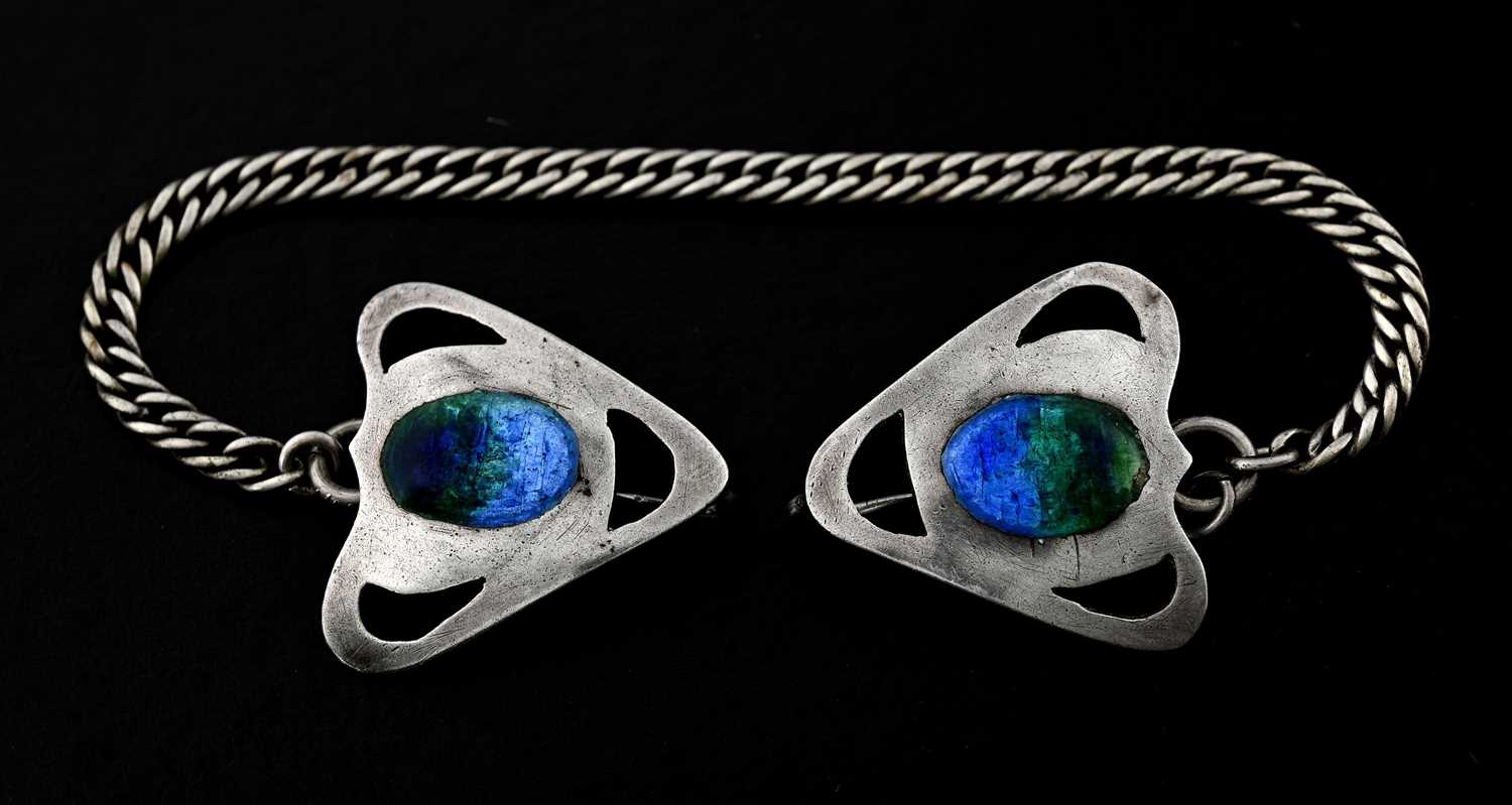 Lot 24 - An Arts & Crafts silver and enamel cloak clasp