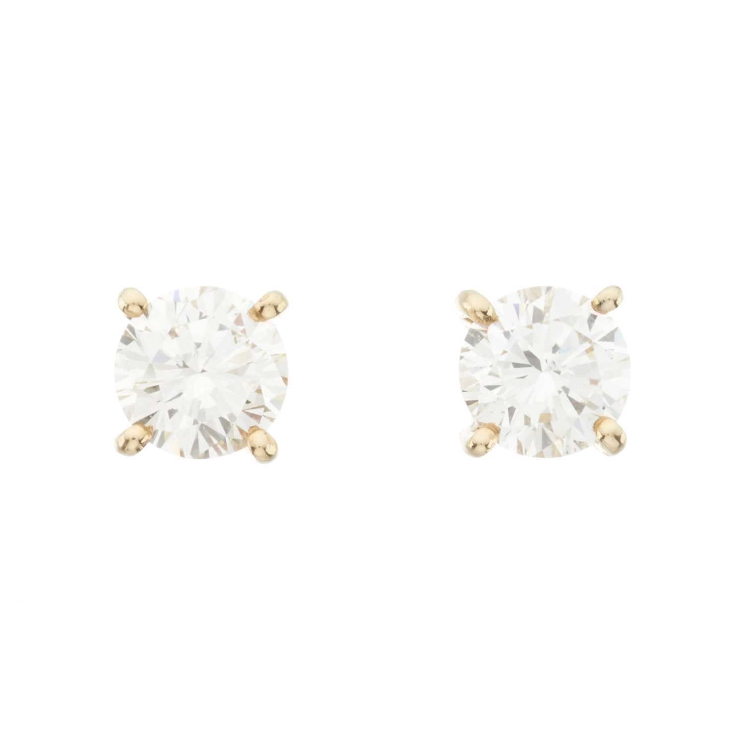 Lot 147 - A pair of 18ct gold brilliant-cut diamond single-stone stud earrings