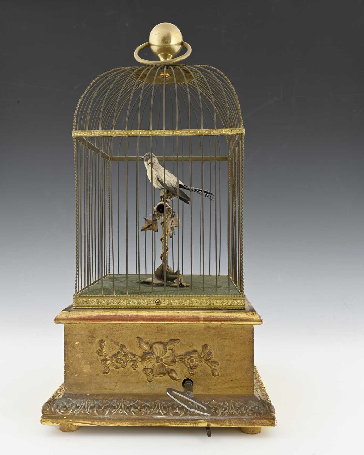 Lot 232 - A clockwork Automaton singing bird in a cage,...