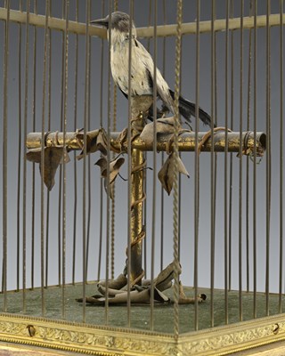 Lot 232 - A clockwork Automaton singing bird in a cage,...