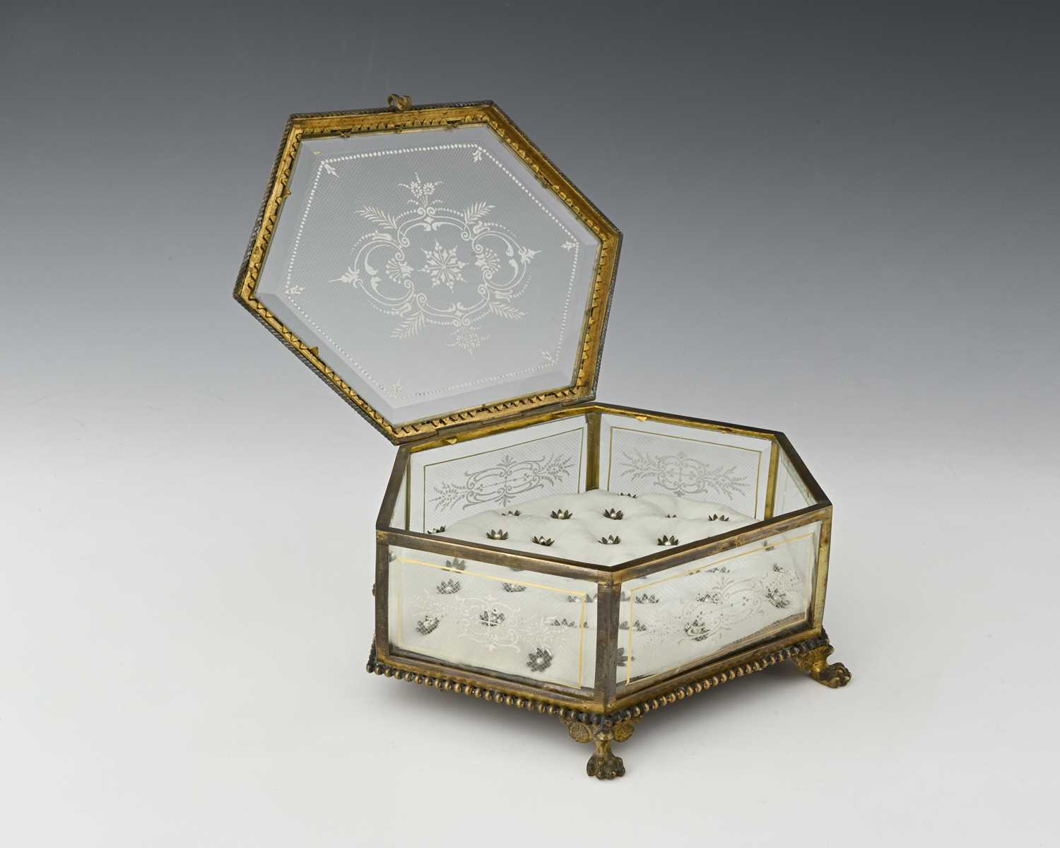 Lot 228 - A French gilt metal and enamelled glass jewel...