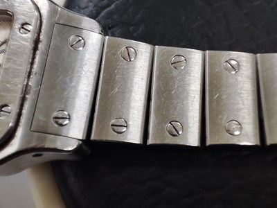 Lot 221 - Cartier, a stainless steel Santos Galbée bracelet watch