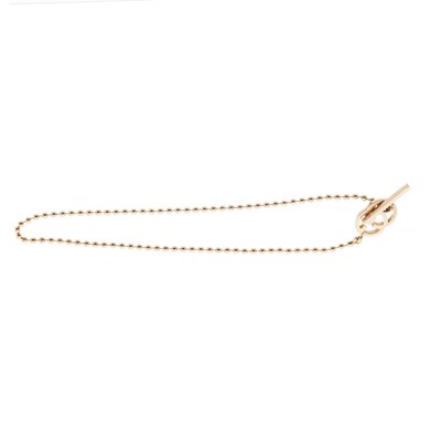 Lot 112 - Gucci, an 18ct gold Running G toggle bracelet