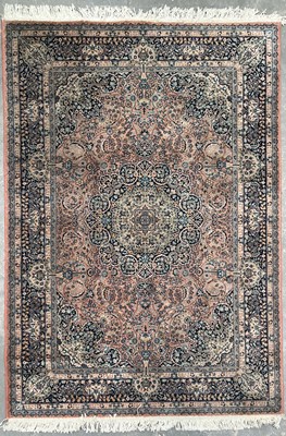 Lot 509 - Modern patterned Afghan wool rug on pink...