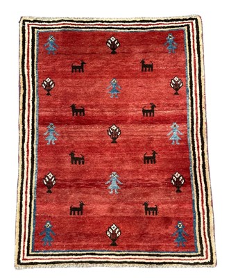 Lot 505 - A Gabbeh rug, with figures, flowers and...