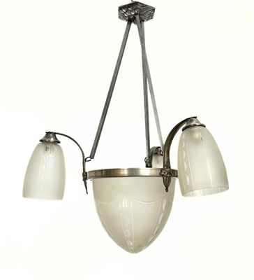Lot 693 - French three branch, 1920s, with central acorn...