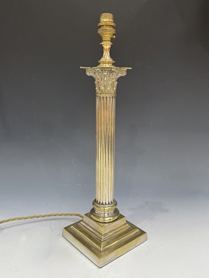 Lot 526 - A late Victorian Corinthian column oil lamp...