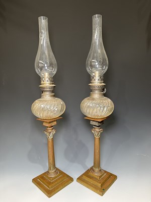 Lot 616 - A pair of French brass Corinthian column oil...