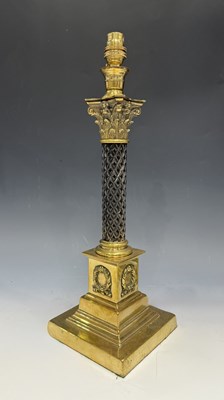 Lot 542 - A Victorian brass Corinthian column table lamp,...