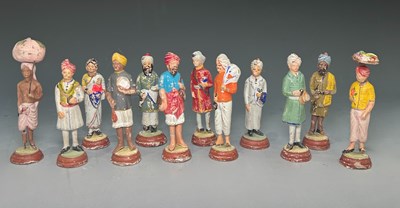 Lot 233 - A collection of twelve Indian painted clay...