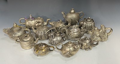 Lot 237A - Thirteen twentieth-century white metal Asian...