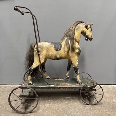 Lot 558 - A 19th century child's walker, carved wood and...