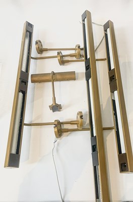 Lot 30A - Three bronzed metal picture lights by Linolite,...