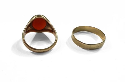 Lot 398 - A 9ct gold carnelian signet ring a wedding band ring