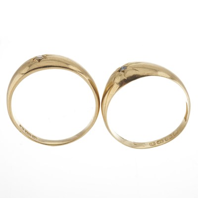 Lot 23 - Two early 20th century 18ct gold diamond accent band rings
