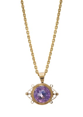 Lot 103 - A 9ct gold amethyst pendant, with 22ct gold chain
