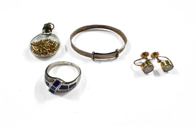 Lot 413 - A 9ct gold mounted flask pendant, a pair of cubic zirconia earrings, a ring and a bangle