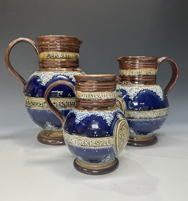 Lot 141 - Doulton Lambeth, a graduated set of three...