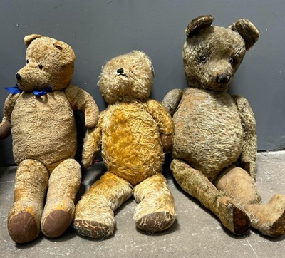 Lot 252 - Three straw-filled golden plush teddy bears,...