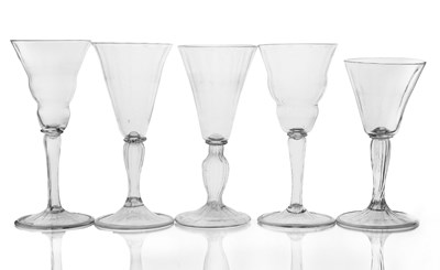 Lot 384 - Five Facon de Venise glass wine goblets, in...