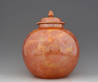 Lot 517 - Ruskin Pottery, a large orange lustre vase and...